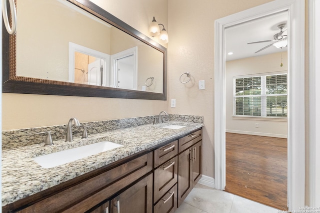 22919 Hightop, Elmendorf, TX 78112 - full bathroom with double vanity, a ceiling fan, baseboards, and tile patterned flooring