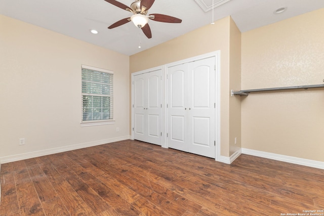 22919 Hightop, Elmendorf, TX 78112 - unfurnished bedroom featuring two closets, attic access, wood finished floors, baseboards, and recessed lighting