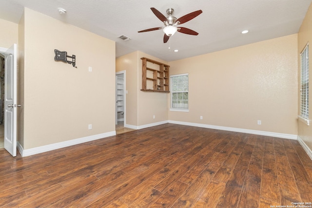 22919 Hightop, Elmendorf, TX 78112 - unfurnished room with ceiling fan, dark wood finished floors, baseboards, recessed lighting, and a smoke detector