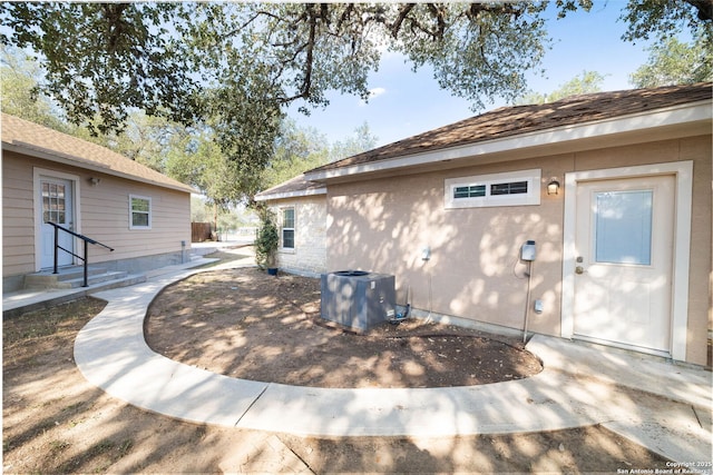 22919 Hightop, Elmendorf, TX 78112 - view of home's exterior featuring central AC
