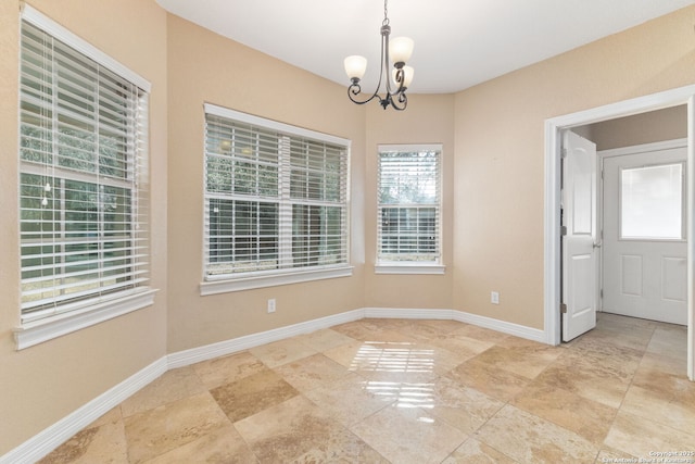 22919 Hightop, Elmendorf, TX 78112 - unfurnished dining area with a chandelier and baseboards