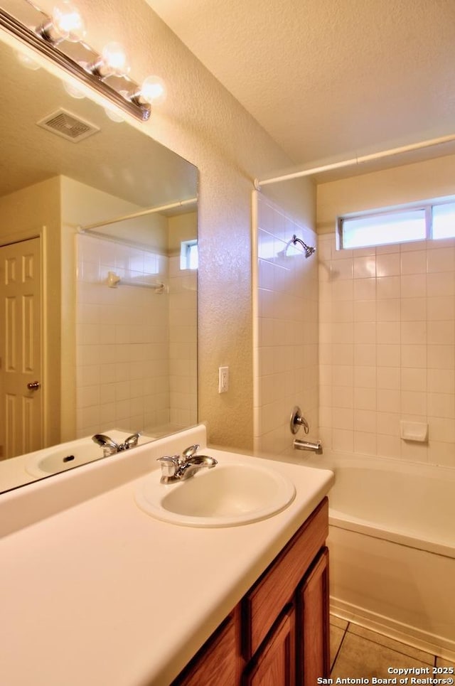 219 Starling, New Braunfels, TX 78130 - full bathroom with vanity,  shower combination, and a textured ceiling