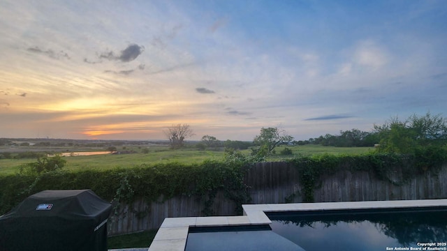 1926 Kalli Jo Ln, New Braunfels, TX 78130 - view of swimming pool with grilling area and a view of rural / pastoral area
