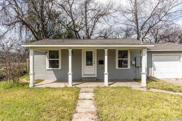 1309 Quintana Rd, San Antonio, TX 78211 - view of front of property with covered porch, a garage, a front lawn, and roof with shingles