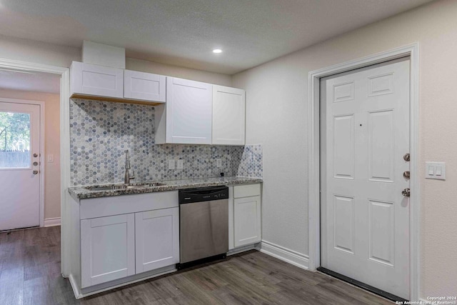 1309 Quintana Rd, San Antonio, TX 78211 - kitchen with dishwasher, a sink, white cabinets, tasteful backsplash, and recessed lighting
