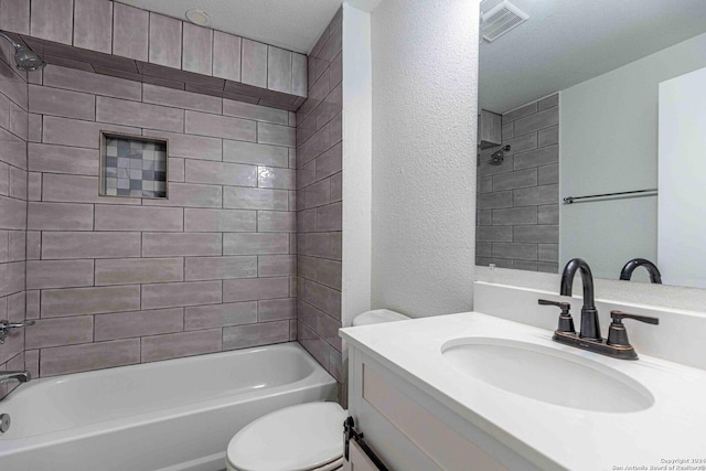 1309 Quintana Rd, San Antonio, TX 78211 - bathroom with toilet, vanity, bathtub / shower combination, and a textured wall