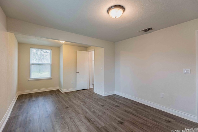 1309 Quintana Rd, San Antonio, TX 78211 - unfurnished room with wood finished floors and baseboards
