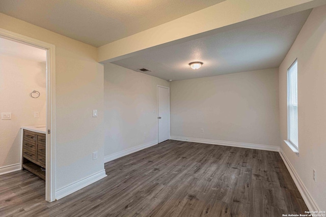 1309 Quintana Rd, San Antonio, TX 78211 - empty room featuring dark wood finished floors and baseboards