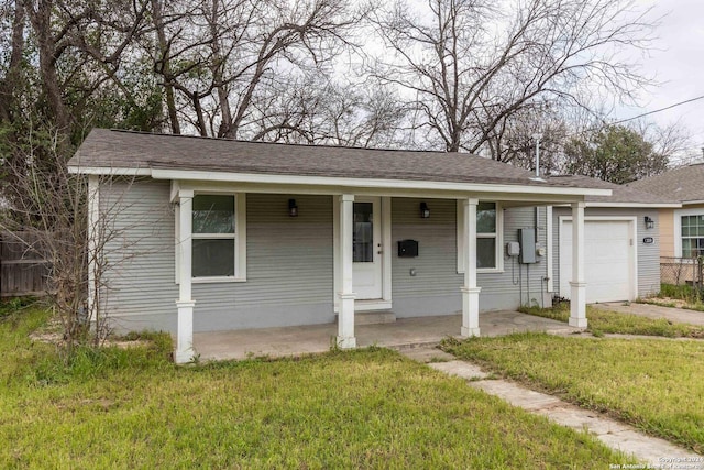 1309 Quintana Rd, San Antonio, TX 78211 - view of front facade featuring an attached garage, a front yard, covered porch, driveway, and a shingled roof