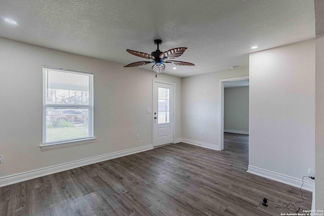 1309 Quintana Rd, San Antonio, TX 78211 - foyer entrance featuring baseboards, dark wood finished floors, ceiling fan, a textured ceiling, and recessed lighting