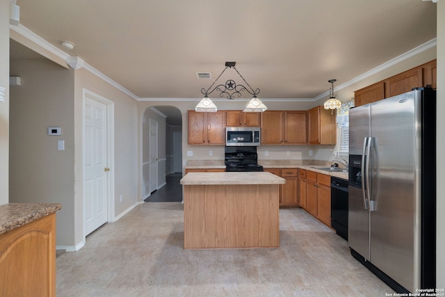 2392 Medina, New Braunfels, TX 78130 - kitchen with appliances with stainless steel finishes, light countertops, arched walkways, a kitchen island, and pendant lighting