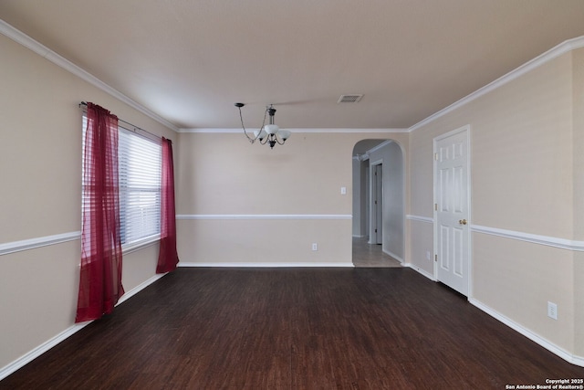 2392 Medina, New Braunfels, TX 78130 - empty room with a chandelier, wood finished floors, arched walkways, baseboards, and crown molding