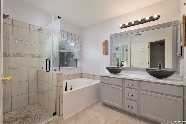 2392 Medina, New Braunfels, TX 78130 - full bathroom with a shower stall, a bath, double vanity, and tile patterned floors