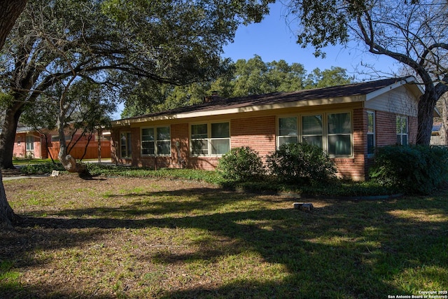 215 Five Oaks, San Antonio, TX 78209 - view of front of home featuring brick siding and a front lawn