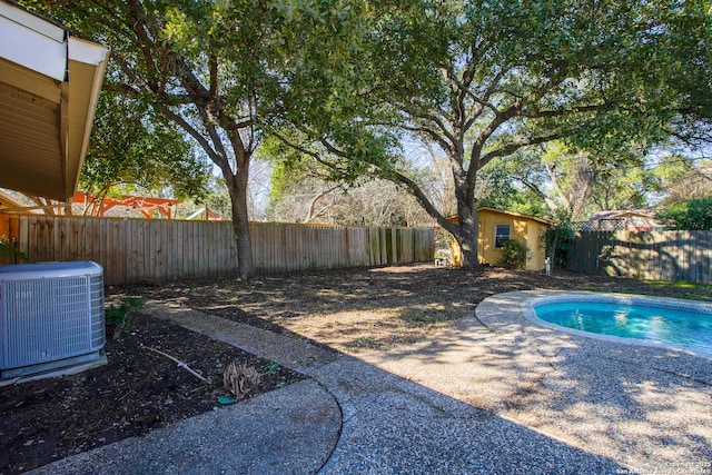 215 Five Oaks, San Antonio, TX 78209 - view of swimming pool with central air condition unit and a fenced backyard