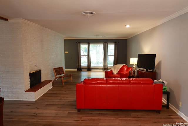 215 Five Oaks, San Antonio, TX 78209 - living room with brick wall, wood finished floors, a fireplace, crown molding, and baseboards