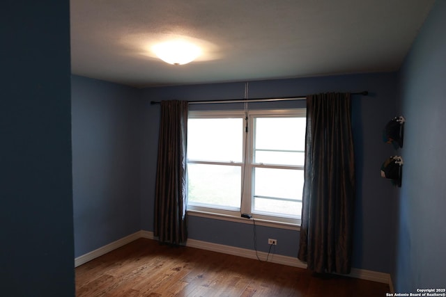 215 Five Oaks, San Antonio, TX 78209 - empty room featuring wood finished floors and baseboards