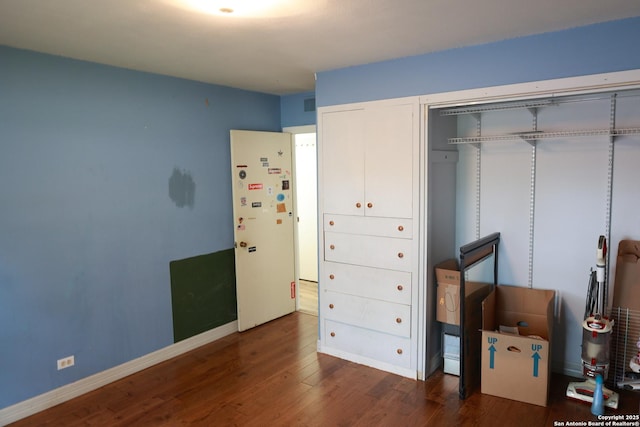 215 Five Oaks, San Antonio, TX 78209 - bedroom with wood finished floors, a closet, and baseboards