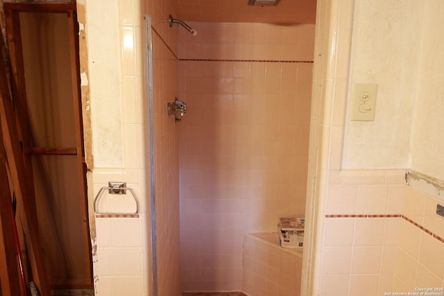215 Five Oaks, San Antonio, TX 78209 - bathroom featuring tile walls and a shower