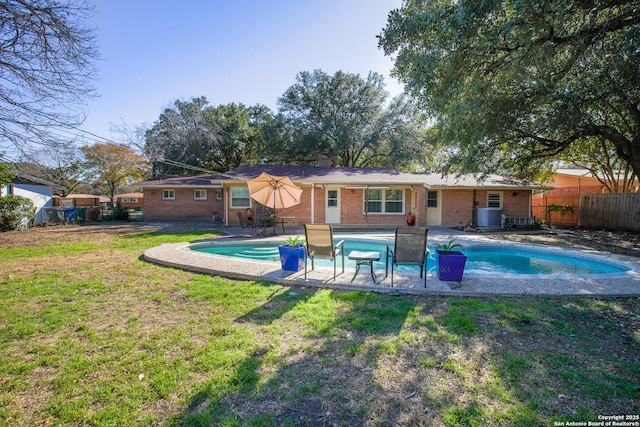 215 Five Oaks, San Antonio, TX 78209 - rear view of house with brick siding, a patio area, central AC unit, and a chimney