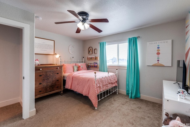 24435 Canyon Row, San Antonio, TX 78260 - bedroom with light colored carpet, ceiling fan, baseboards, and a textured ceiling