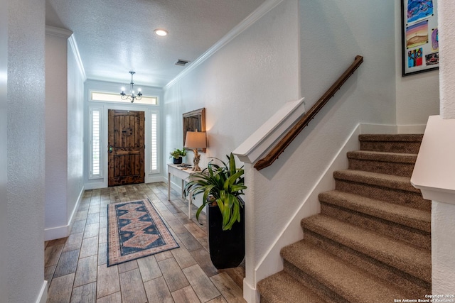 24435 Canyon Row, San Antonio, TX 78260 - entryway featuring crown molding, a chandelier, stairs, wood finished floors, and baseboards