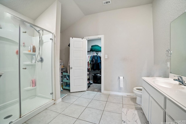 6907 Emerald Vly, San Antonio, TX 78242 - full bathroom featuring a shower stall, vanity, a walk in closet, toilet, and vaulted ceiling