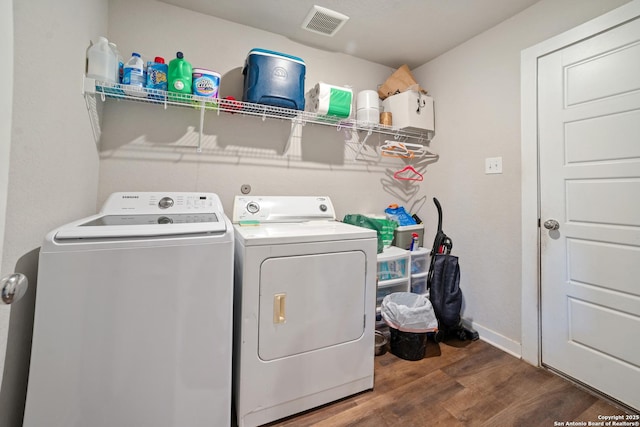6907 Emerald Vly, San Antonio, TX 78242 - washroom with washer and clothes dryer, wood finished floors, and baseboards