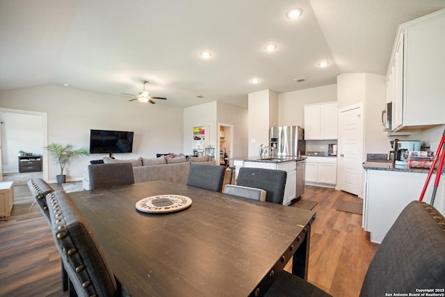 6907 Emerald Vly, San Antonio, TX 78242 - dining room with vaulted ceiling, a ceiling fan, dark wood finished floors, and recessed lighting