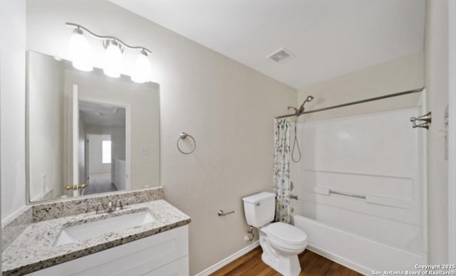 4039 Privet, San Antonio, TX 78259 - full bathroom with wood finished floors, shower / tub combo, vanity, toilet, and baseboards