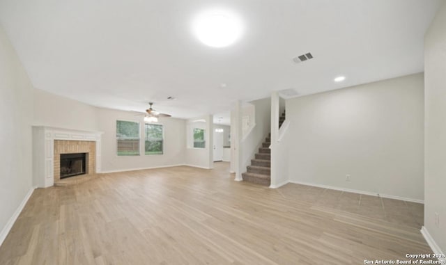 4039 Privet, San Antonio, TX 78259 - unfurnished living room featuring light wood finished floors, a ceiling fan, baseboards, a fireplace, and recessed lighting