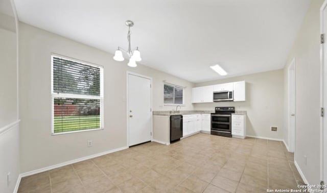 4039 Privet, San Antonio, TX 78259 - kitchen featuring stainless steel appliances, a chandelier, light countertops, white cabinetry, and pendant lighting