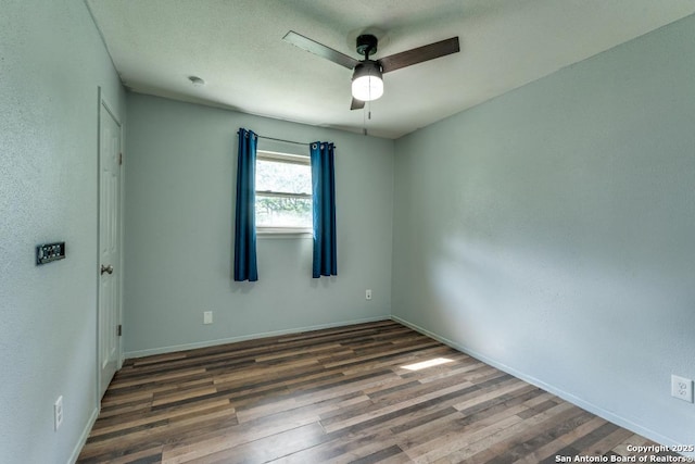 289 Deer Slayer, Seguin, TX 78155 - spare room featuring ceiling fan, wood finished floors, and baseboards