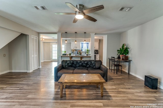 289 Deer Slayer, Seguin, TX 78155 - living room featuring a ceiling fan, wood finished floors, and baseboards