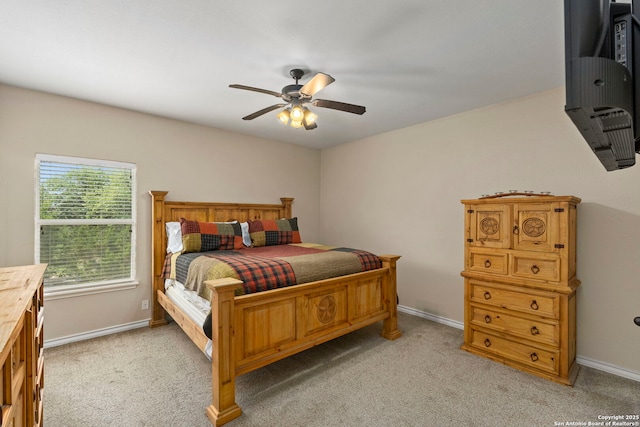 1355 Lasso, Canyon Lake, TX 78133 - bedroom featuring light colored carpet, ceiling fan, and baseboards