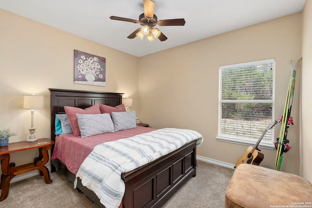 1355 Lasso, Canyon Lake, TX 78133 - bedroom featuring light colored carpet, multiple windows, baseboards, and a ceiling fan
