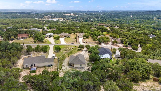 1355 Lasso, Canyon Lake, TX 78133 - view of property location featuring a heavily wooded area and nearby suburban area