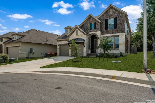 375 Sonata Cyn, Spring Branch, TX 78070 - french country style house with stone siding, concrete driveway, a front lawn, a garage, and brick siding