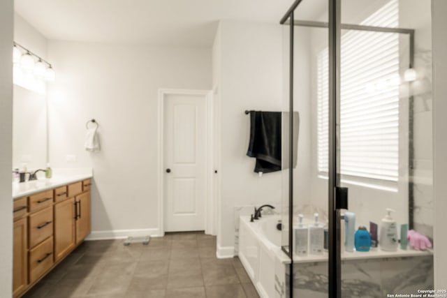 375 Sonata Cyn, Spring Branch, TX 78070 - bathroom with vanity, a garden tub, a shower stall, tile patterned flooring, and baseboards