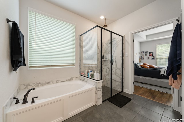 375 Sonata Cyn, Spring Branch, TX 78070 - full bathroom featuring connected bathroom, a garden tub, a marble finish shower, and tile patterned flooring