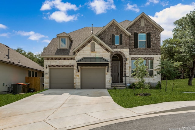 375 Sonata Cyn, Spring Branch, TX 78070 - french country home featuring stone siding, concrete driveway, brick siding, cooling unit, and roof with shingles