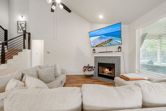 375 Sonata Cyn, Spring Branch, TX 78070 - living area featuring wood finished floors, a ceiling fan, high vaulted ceiling, a tile fireplace, and baseboards