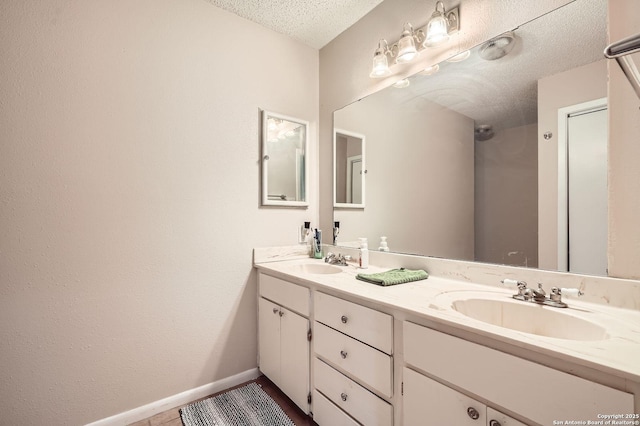 8517 Echo Crk, San Antonio, TX 78240 - full bath featuring double vanity, a textured ceiling, and baseboards