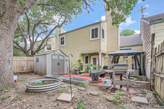 8517 Echo Crk, San Antonio, TX 78240 - rear view of house with a chimney, a gazebo, and a fenced backyard