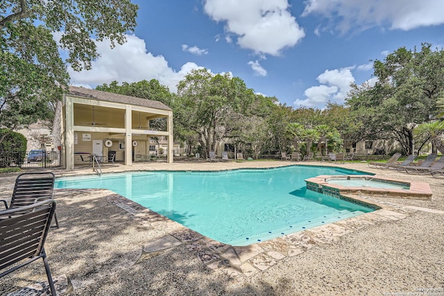 8517 Echo Crk, San Antonio, TX 78240 - view of swimming pool featuring a patio, a pool with connected hot tub, and view of scattered trees