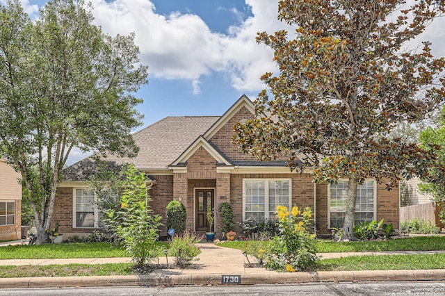 1730 Escada, San Antonio, TX 78258 - traditional-style house with brick siding and roof with shingles