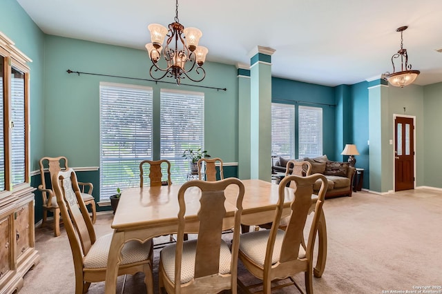 1730 Escada, San Antonio, TX 78258 - dining space with light carpet, a chandelier, and baseboards