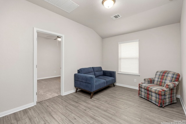 3065 Charyn Way, New Braunfels, TX 78132 - living area featuring lofted ceiling, light wood finished floors, baseboards, and a ceiling fan