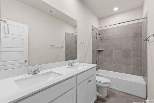 3065 Charyn Way, New Braunfels, TX 78132 - bathroom featuring toilet, tile patterned floors, double vanity, washtub / shower combination, and recessed lighting