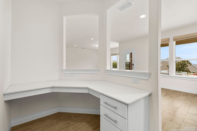 3082 Bright Skies, San Antonio, TX 78261 - unfurnished office featuring plenty of natural light, wood finish floors, built in study area, and recessed lighting